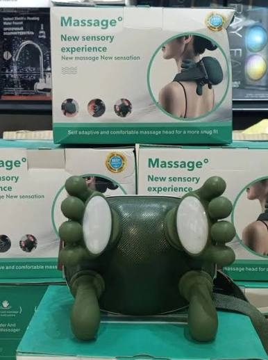 Original supplied photo showing the white contact pads and green massage elements